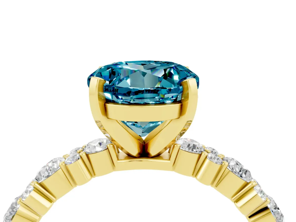 Round Cut Blue Topaz Side Stone Solitaire Ring with Round and Four-Prong Setting Yellow gold