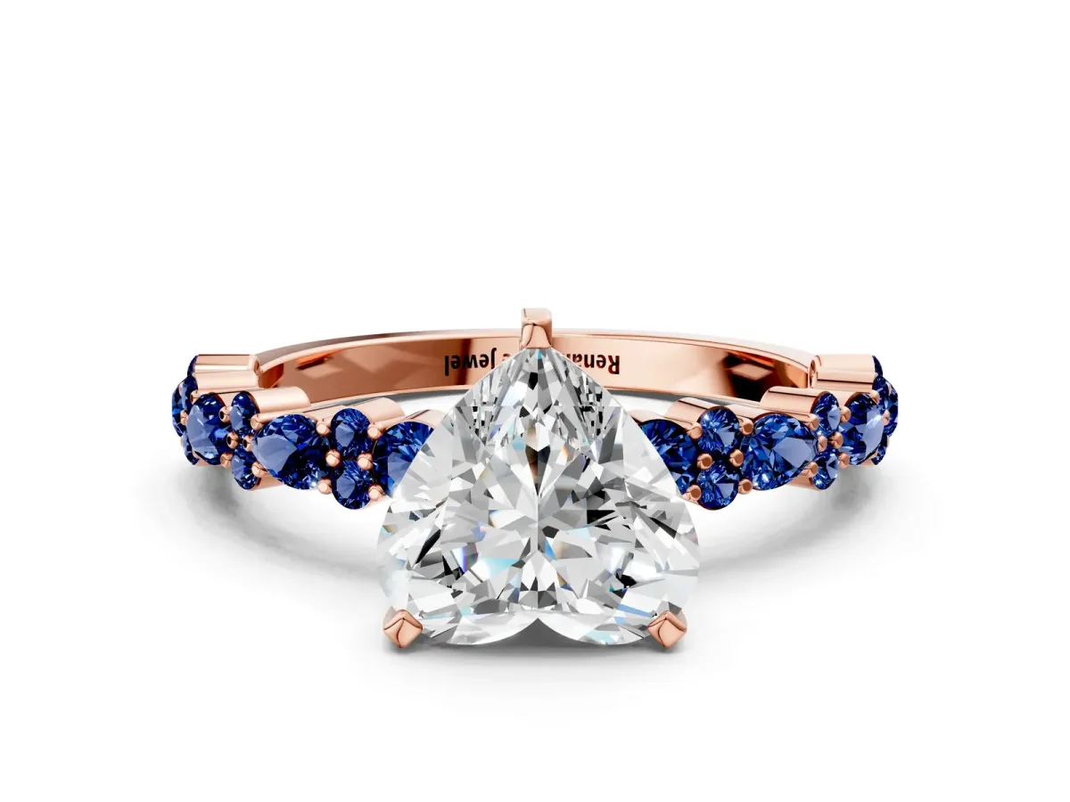 Heart Cut Diamond Side Stone Solitaire Ring with Round Blue Sapphire and Four-Prong Setting Rose gold