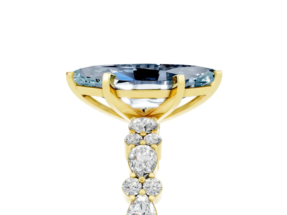 Marquise Cut Aquamarine Side Stone Solitaire Ring with Round and Four-Prong Setting Yellow gold