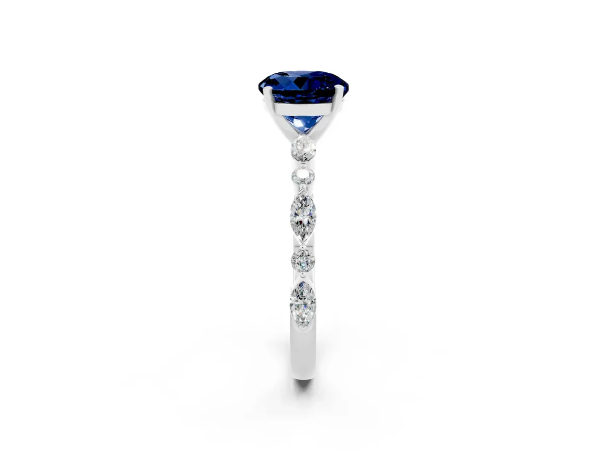 Round Cut Blue Sapphire Ring with Marquise and Round Side Stones and Four-Prong Setting Silver