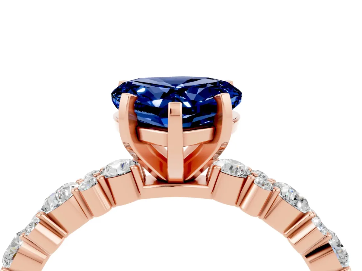 Heart Cut Blue Sapphire Side Stone Solitaire Ring with Round and Four-Prong Setting Rose gold