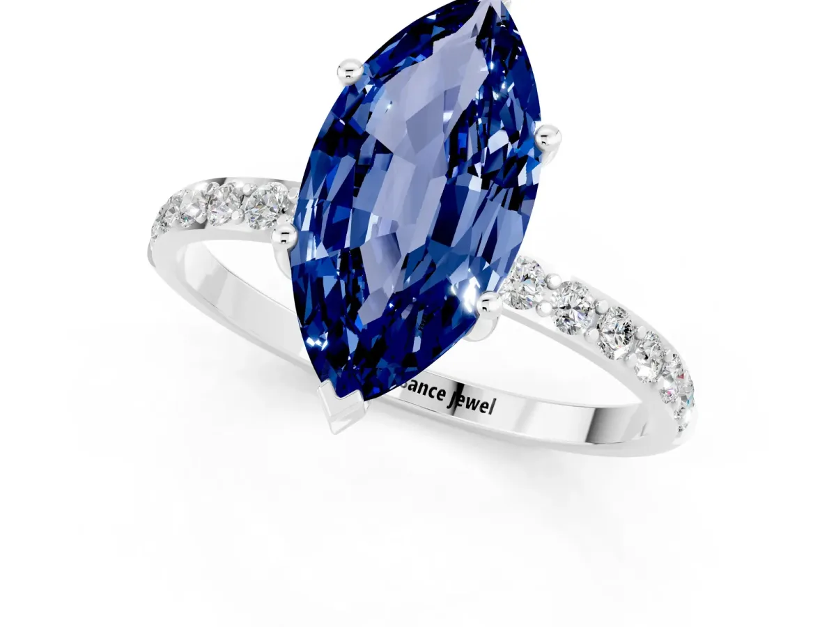 Marquise Cut Blue Sapphire Solitaire Ring with Round Pavé Band and Prong Setting Silver