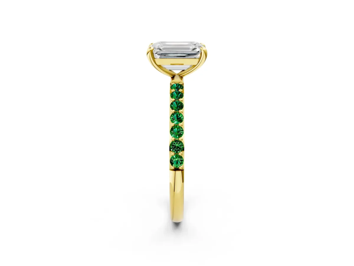 Emerald Cut Diamond Solitaire Ring with Round Emerald Pavé Band and Prong Setting Yellow gold