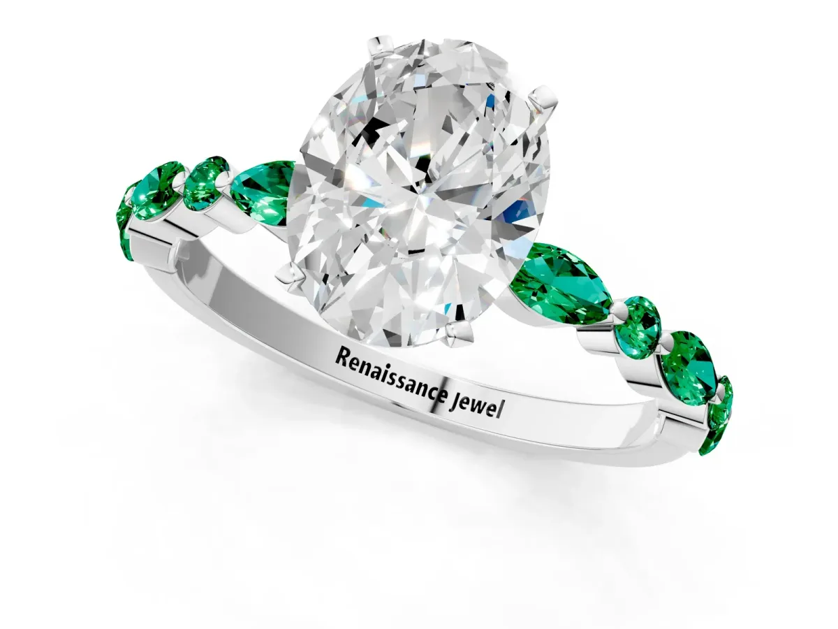 Oval Cut Diamond Ring with Marquise and Round Emerald Side Stones and Four-Prong Setting White gold