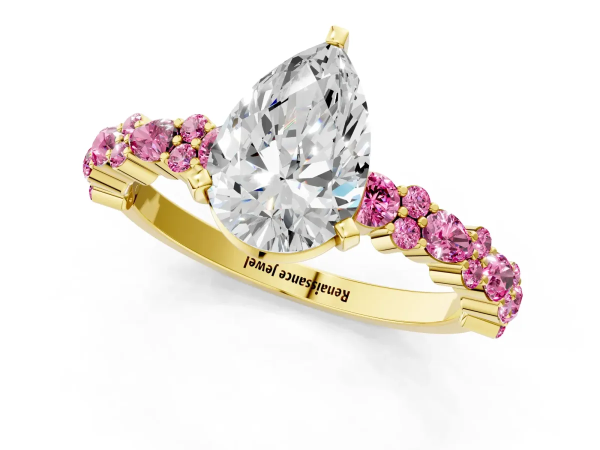 Pear Cut Diamond Side Stone Solitaire Ring with Round Pink Sapphire and Four-Prong Setting Yellow gold