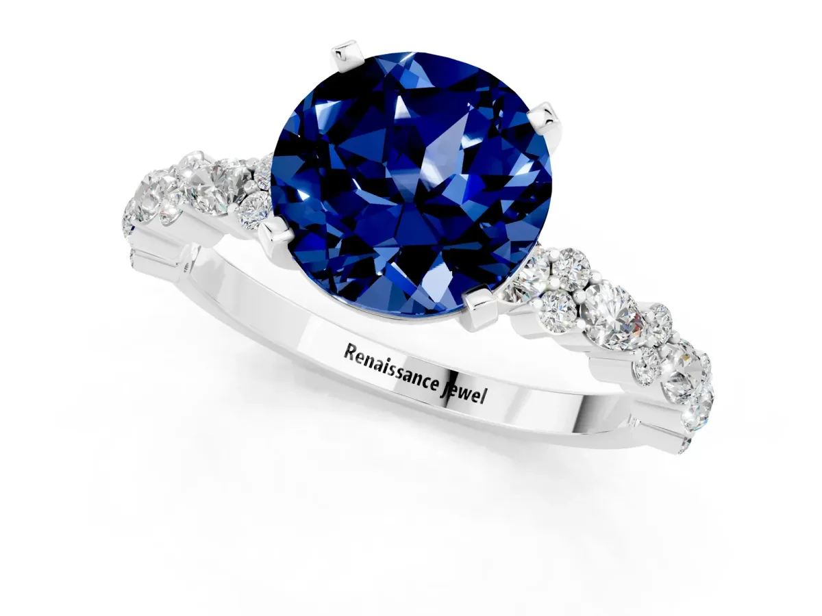 Round Cut Blue Sapphire Side Stone Solitaire Ring with Round and Four-Prong Setting White gold