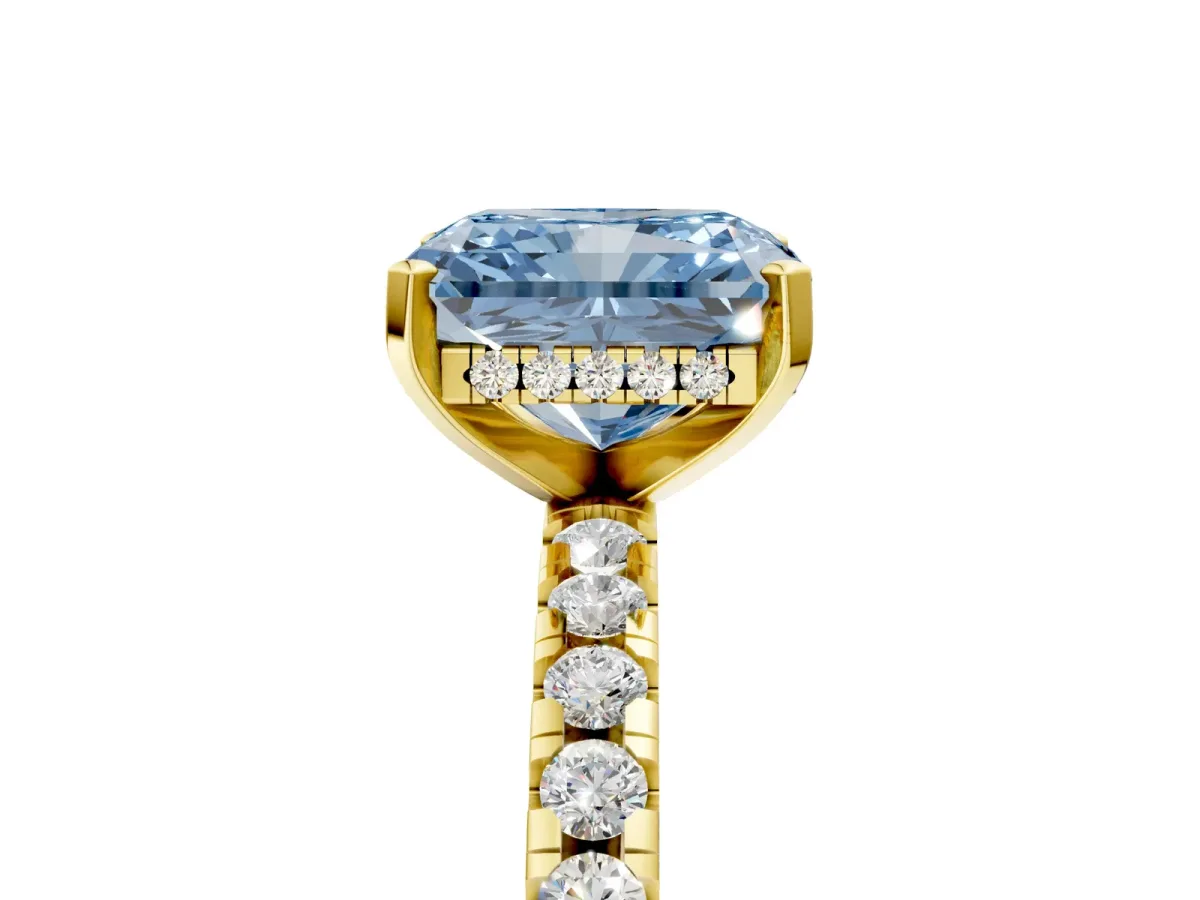 Fancy Blue Radiant Cut Diamond Solitaire Ring with Round Pavé Band and Four-Prong Setting Yellow gold