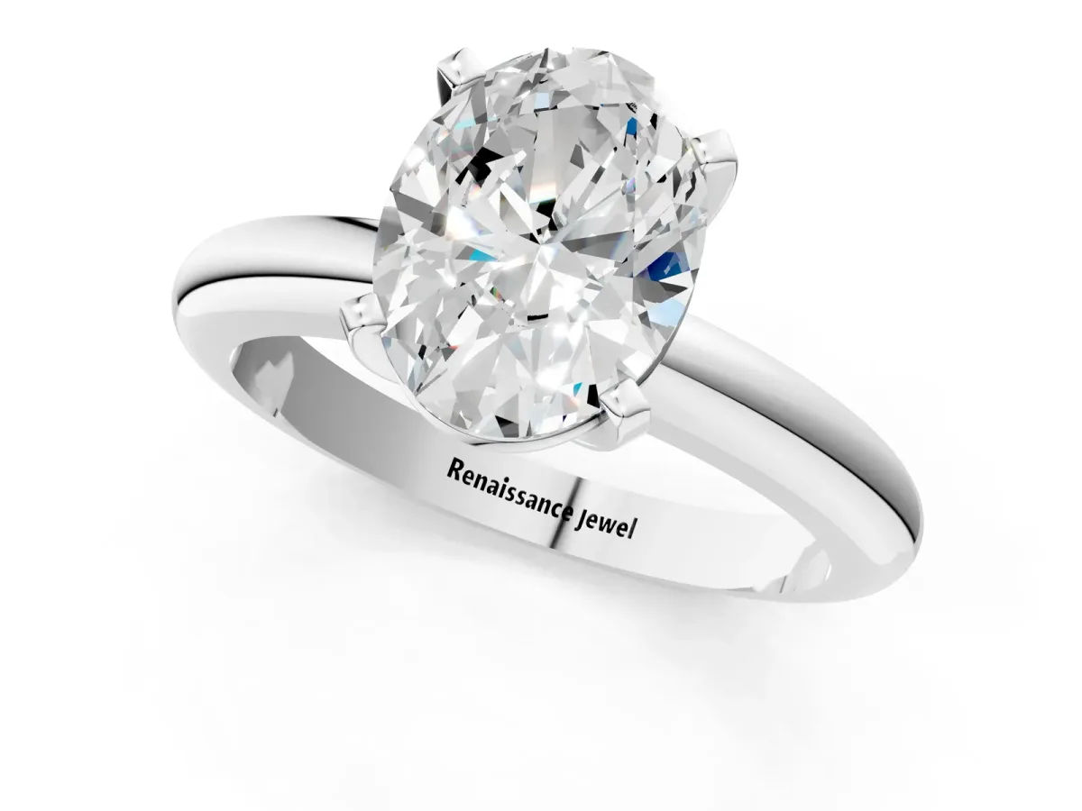 Oval Cut Diamond Solitaire Engagement Ring with Round Band and Four-Prong Setting White gold