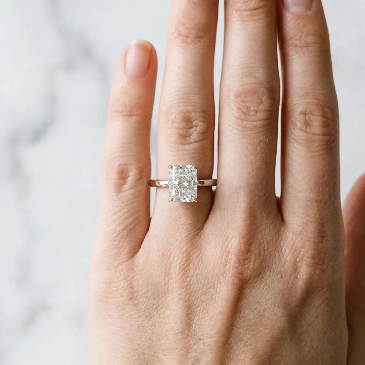 Radiant Cut Diamond Solitaire Engagement Ring with Classic Band and Four-Prong Setting Platinum