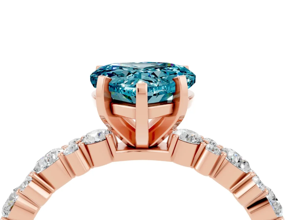 Heart Cut Blue Topaz Side Stone Solitaire Ring with Round and Four-Prong Setting Rose gold