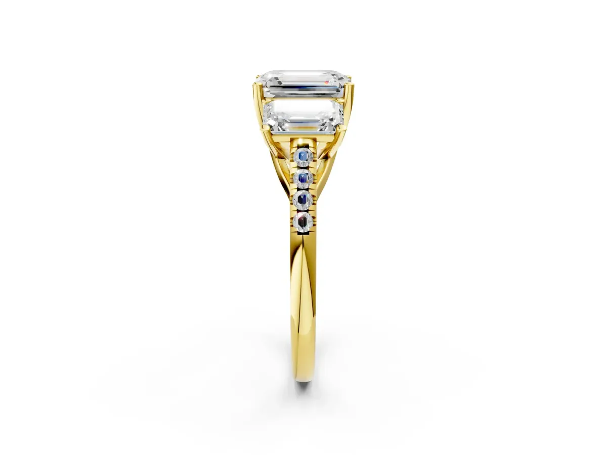 Three-Stone Emerald Cut Diamond Ring with Round Moissanite Pavé Band and Prong Setting Yellow gold