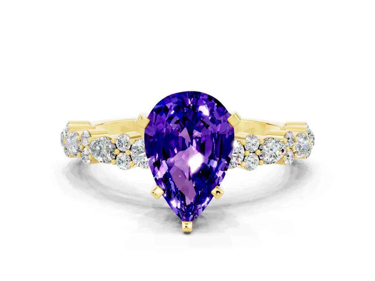 Pear Cut Tanzanite Side Stone Solitaire Ring with Round and Four-Prong Setting Yellow gold