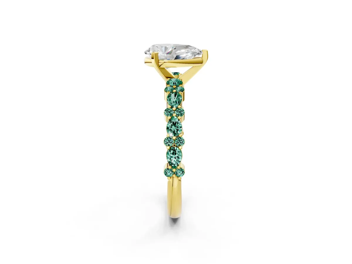 Pear Cut Diamond Side Stone Solitaire Ring with Round Green Sapphire and Four-Prong Setting Yellow gold