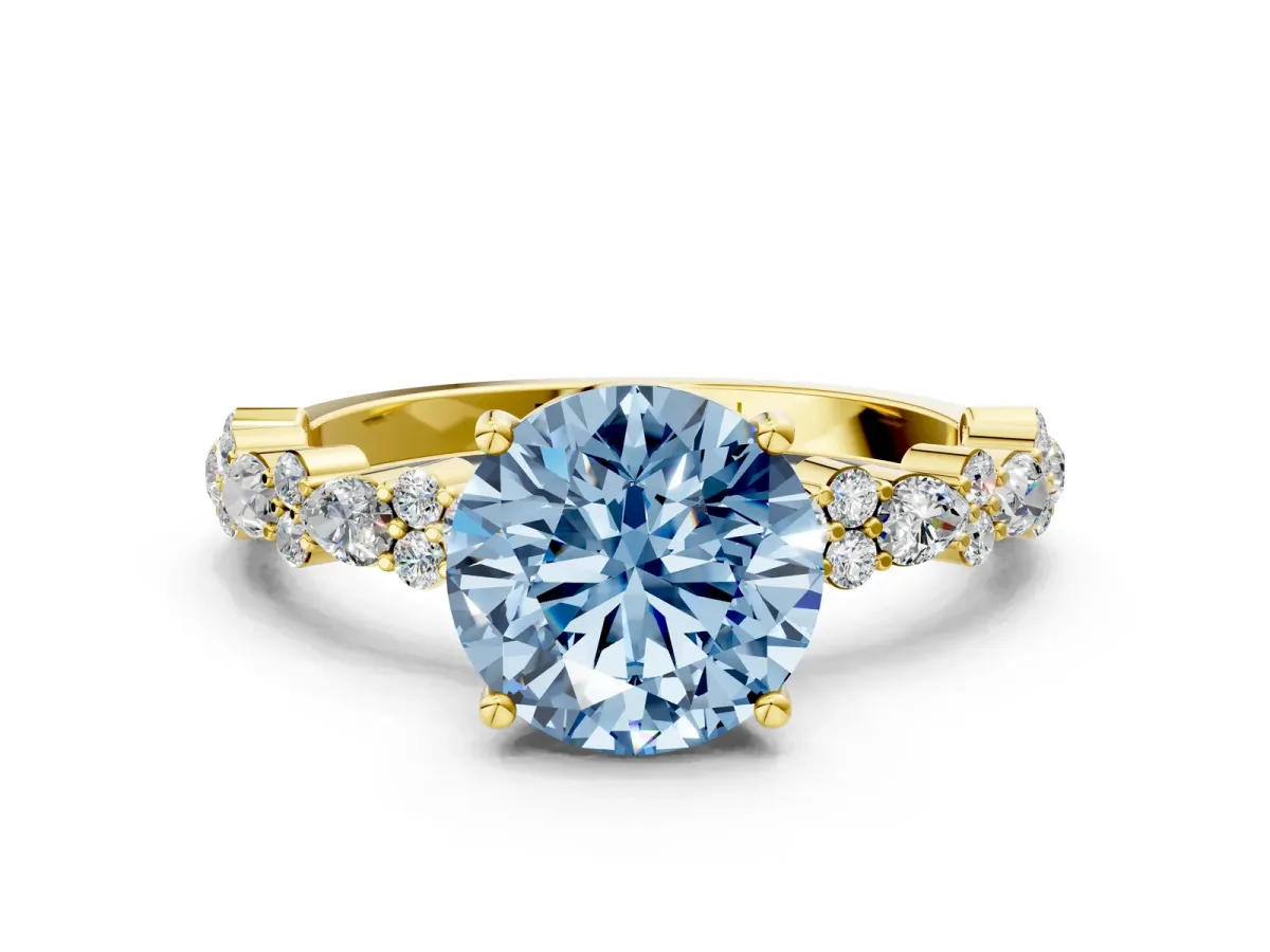 Fancy Blue Round Cut Diamond Side Stone Solitaire Ring with Round and Four-Prong Setting Yellow gold