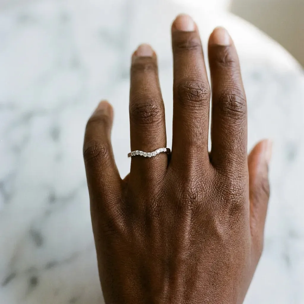 Curved Diamond Wedding Band with Round Cut Stones and Shared Prong Setting White gold