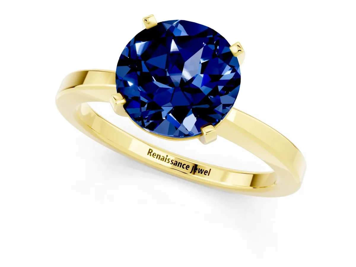 Round Cut Blue Sapphire Solitaire Engagement Ring with Classic Band and Four-Prong Setting Yellow gold