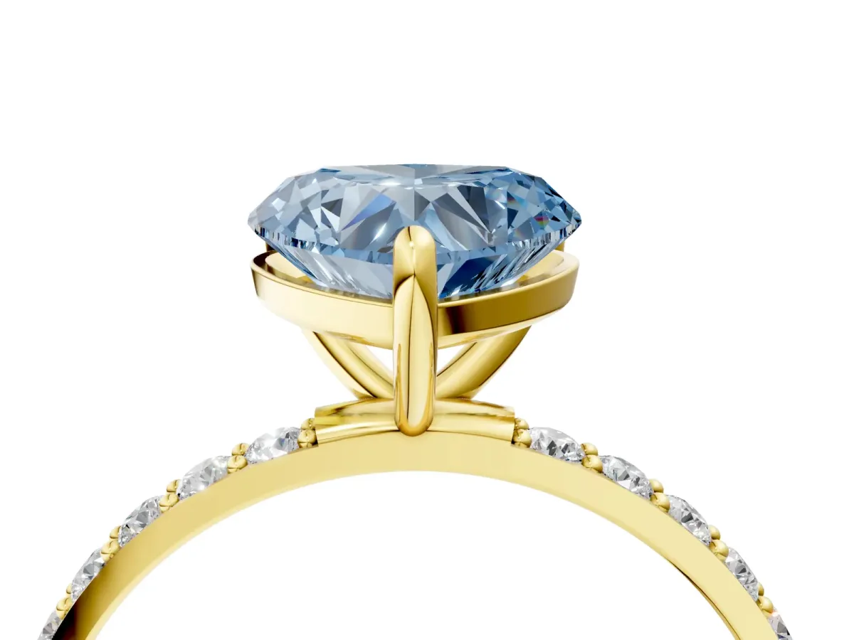 Fancy Blue Heart Cut Diamond Solitaire Ring with Round Pavé Band and Prong Setting Yellow gold