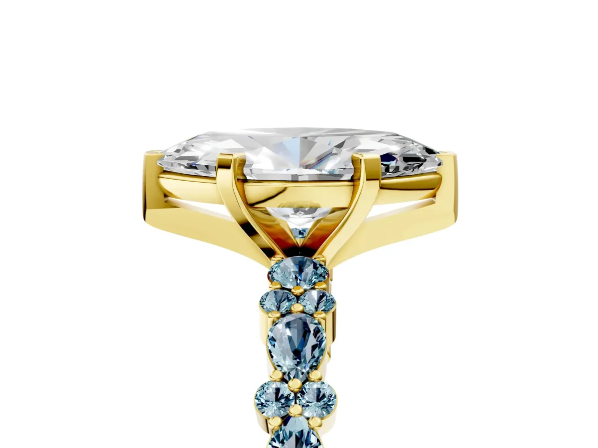 Marquise Cut Diamond Side Stone Solitaire Ring with Round Aquamarine and Four-Prong Setting Yellow gold