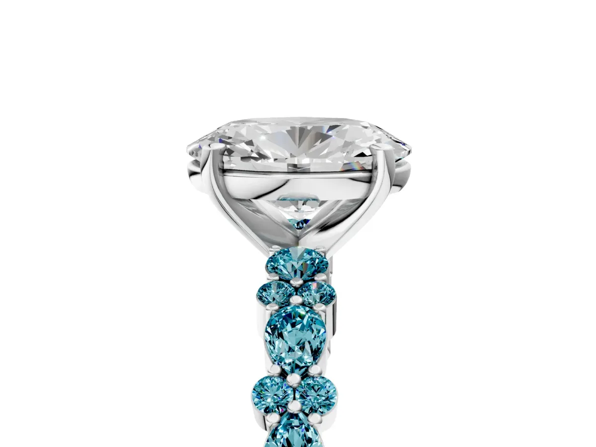 Oval Cut Diamond Side Stone Solitaire Ring with Round Blue Topaz and Four-Prong Setting White gold
