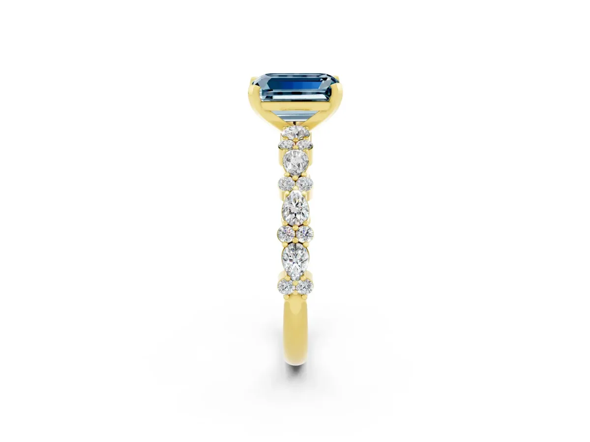 Emerald Cut Aquamarine Side Stone Solitaire Ring with Round and Four-Prong Setting Yellow gold