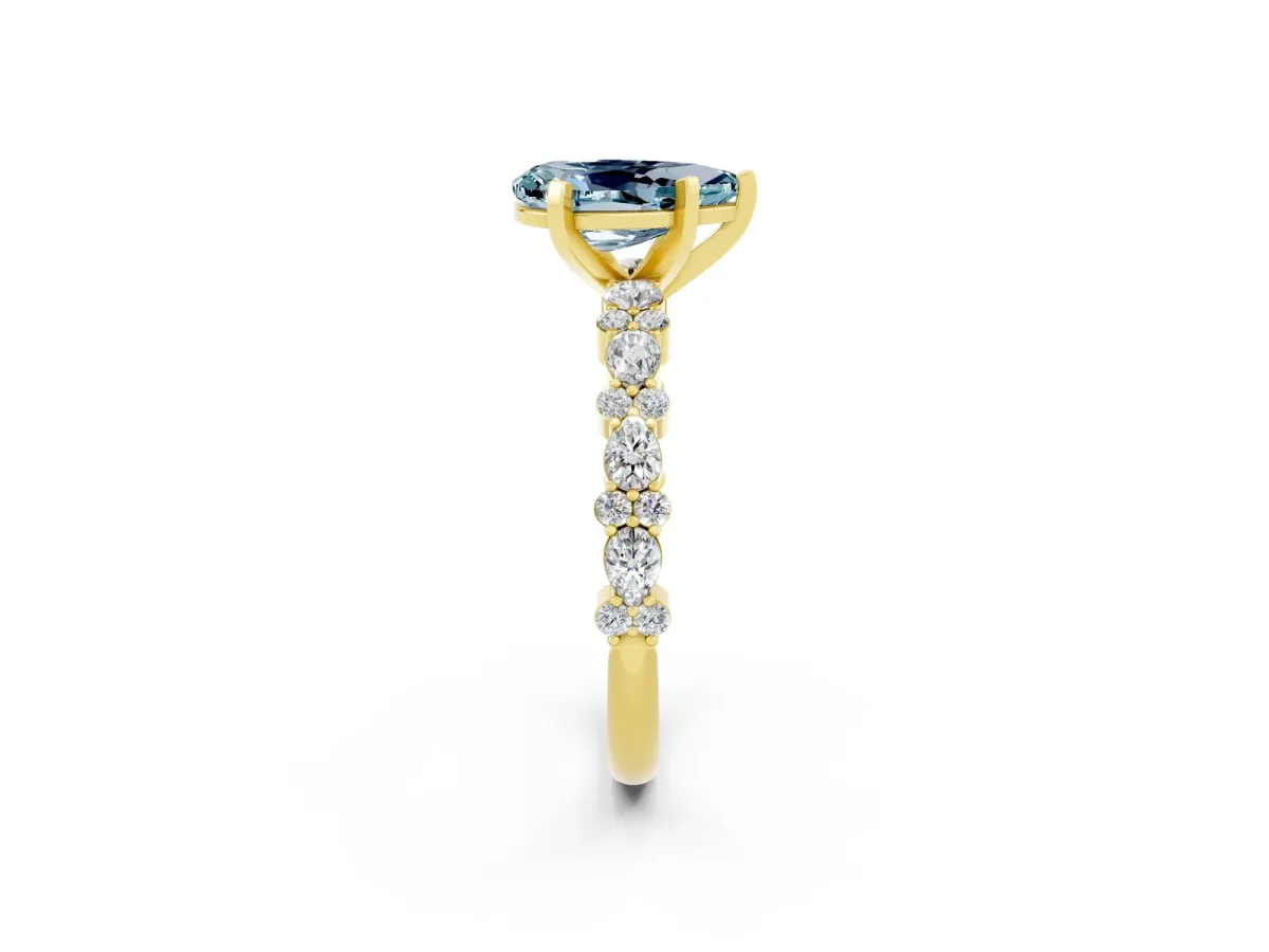 Pear Cut Aquamarine Side Stone Solitaire Ring with Round and Four-Prong Setting Yellow gold
