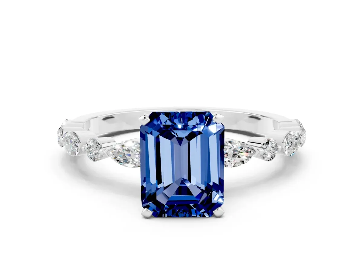 Emerald Cut Blue Sapphire Ring with Marquise and Round Side Stones and Four-Prong Setting Silver