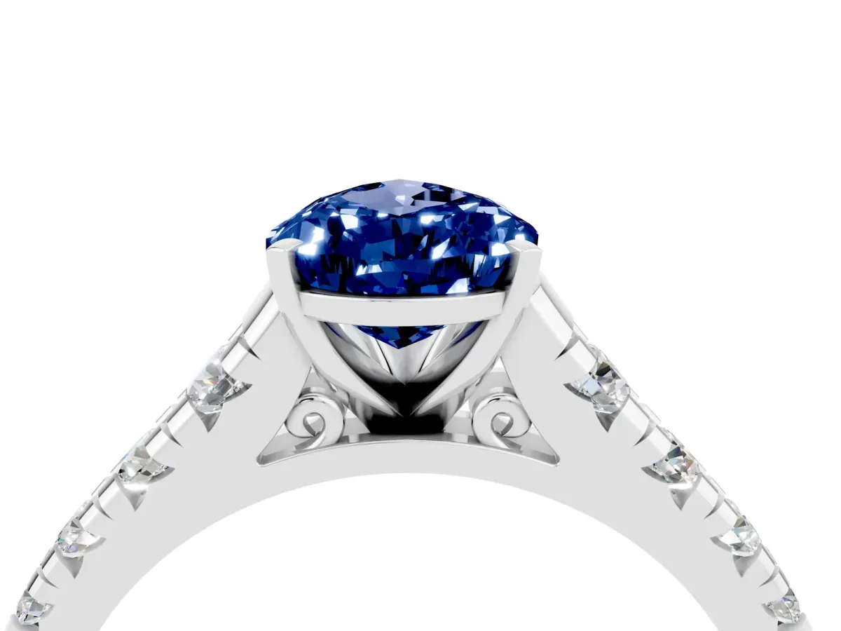 Pear Cut Blue Sapphire Cathedral Solitaire Ring with Round Pavé Band White gold