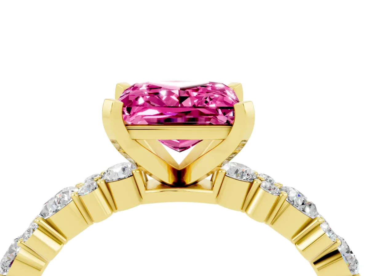 Princess Cut Pink Sapphire Side Stone Solitaire Ring with Round and Four-Prong Setting Yellow gold