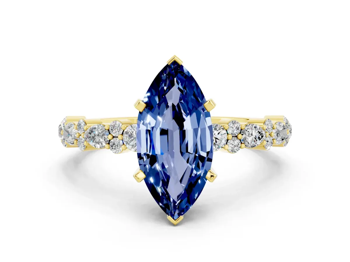 Marquise Cut Blue Sapphire Side Stone Solitaire Ring with Round and Four-Prong Setting Yellow gold