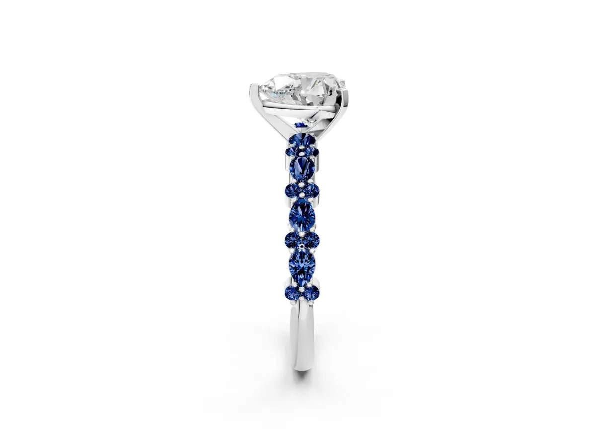Heart Cut Diamond Side Stone Solitaire Ring with Round Blue Sapphire and Four-Prong Setting White gold