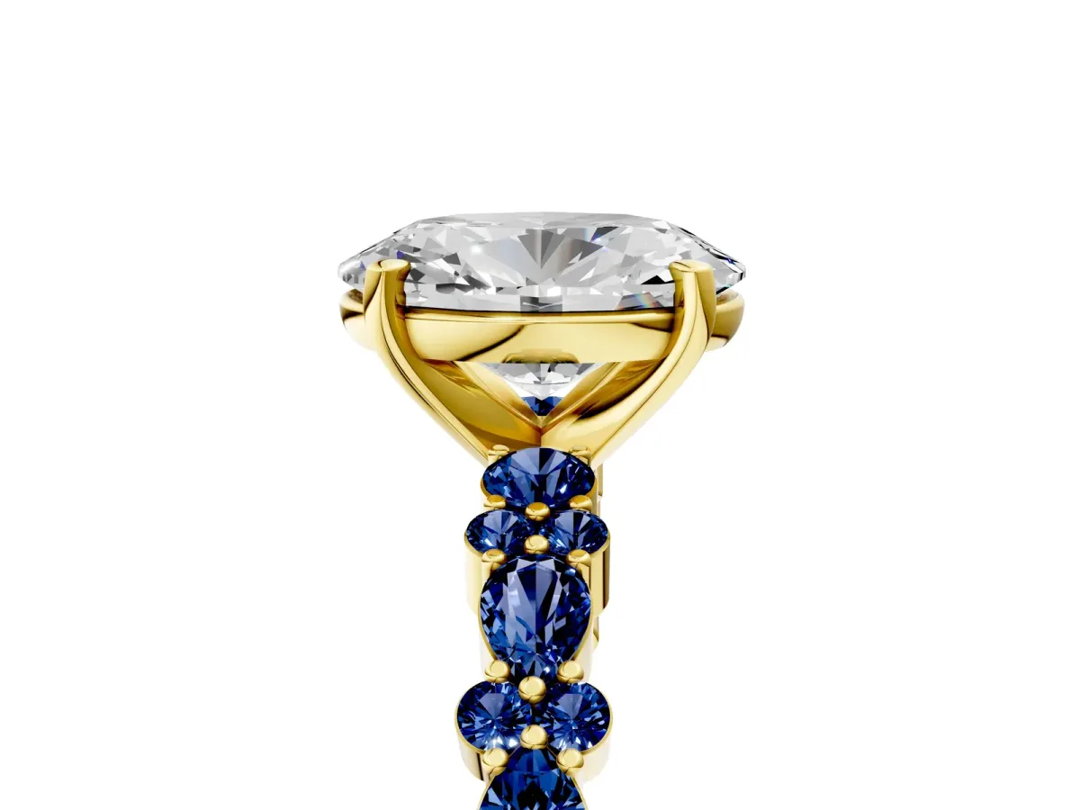 Oval Cut Diamond Side Stone Solitaire Ring with Round Blue Sapphire and Four-Prong Setting Yellow gold