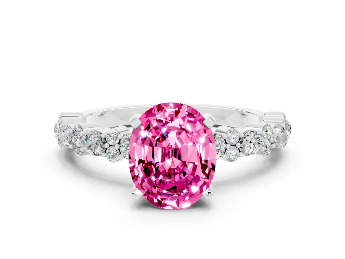 Oval Cut Pink Sapphire Side Stone Solitaire Ring with Round and Four-Prong Setting White gold