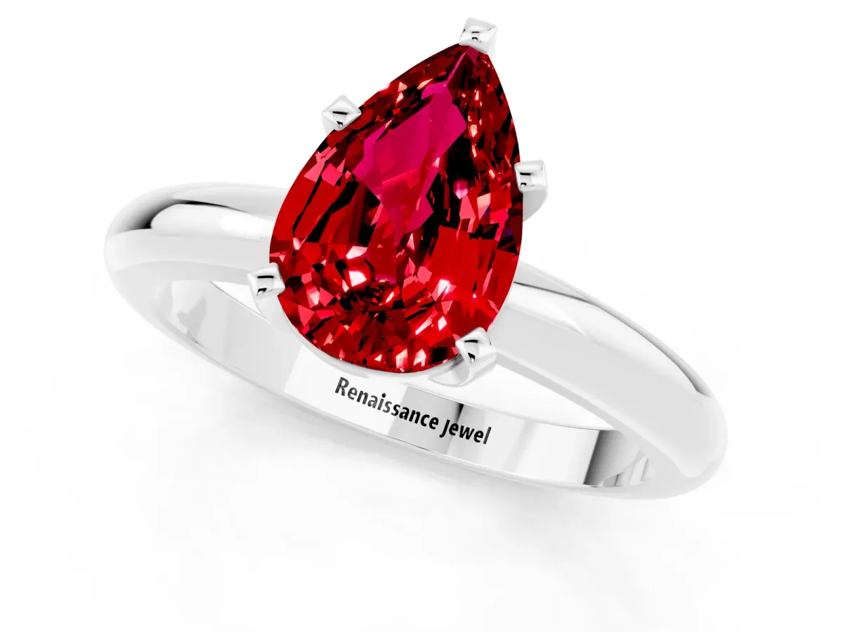 Pear Cut Ruby Solitaire Engagement Ring with Round Band and Four-Prong Setting Silver