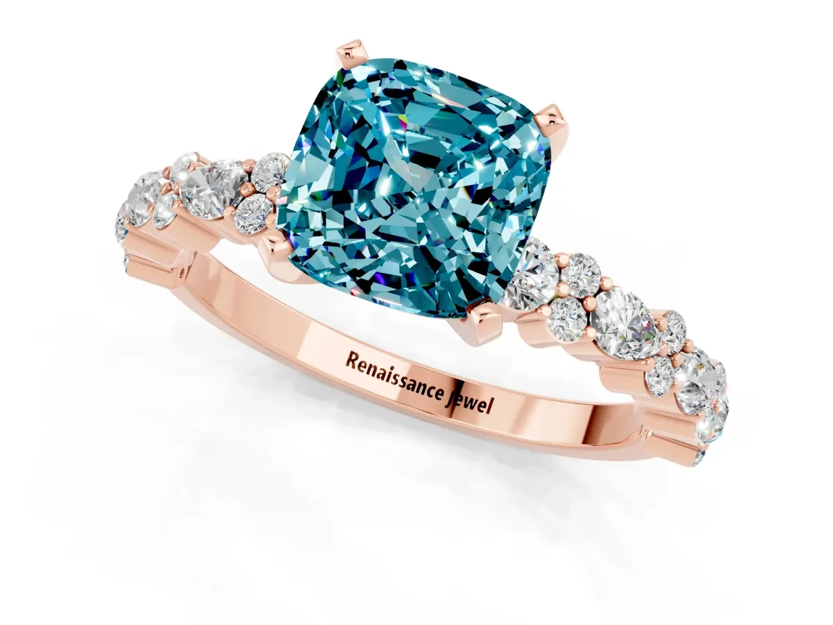 Cushion Cut Blue Topaz Side Stone Solitaire Ring with Round and Four-Prong Setting Rose gold
