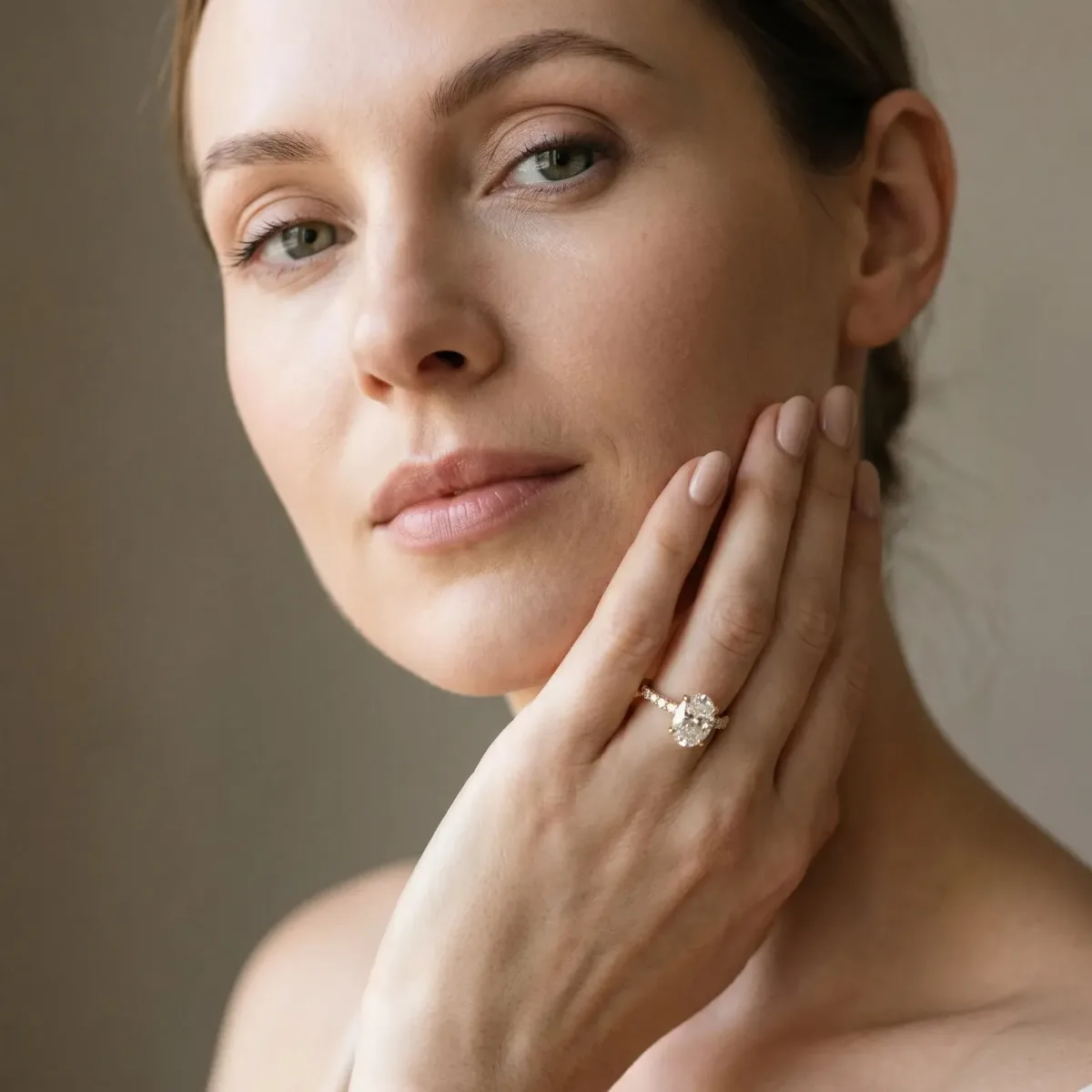 Oval Cut Diamond Solitaire Ring with Round Pavé Band and Four-Prong Setting Yellow gold