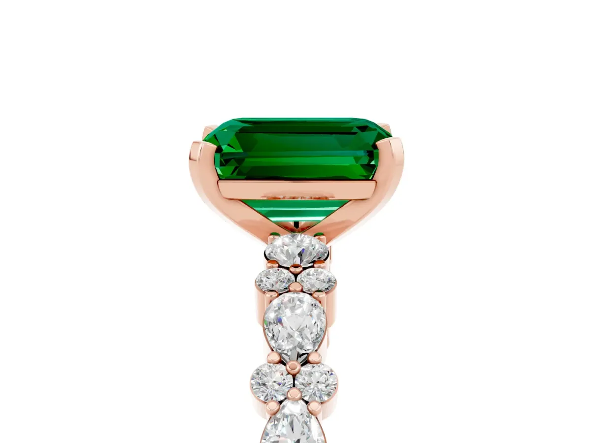 Emerald Cut Emerald Side Stone Solitaire Ring with Round and Four-Prong Setting Rose gold