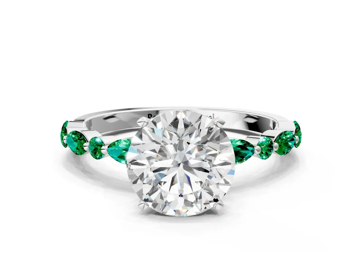 Round Cut Diamond Ring with Marquise and Round Emerald Side Stones and Four-Prong Setting Platinum