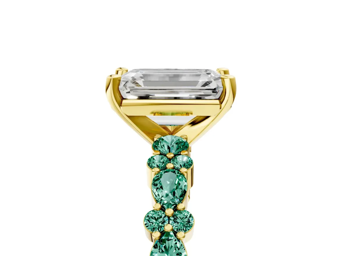 Emerald Cut Diamond Side Stone Solitaire Ring with Round Green Sapphire and Four-Prong Setting Yellow gold
