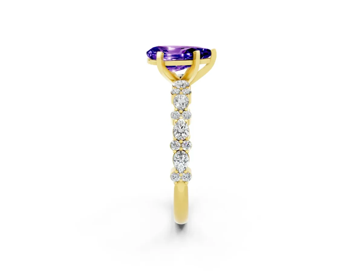 Pear Cut Tanzanite Side Stone Solitaire Ring with Round and Four-Prong Setting Yellow gold