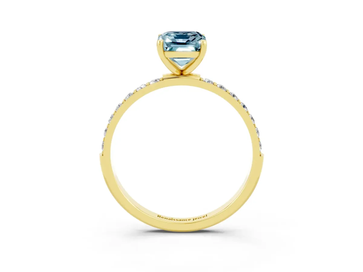 Emerald Cut Aquamarine Solitaire Ring with Round Pavé Band and Prong Setting Yellow gold
