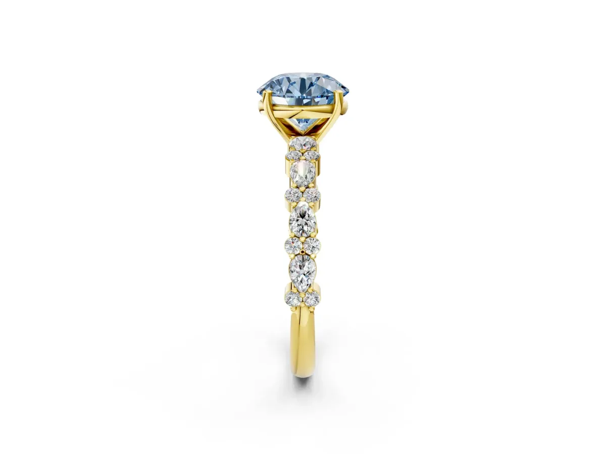 Fancy Blue Round Cut Diamond Side Stone Solitaire Ring with Round and Four-Prong Setting Yellow gold