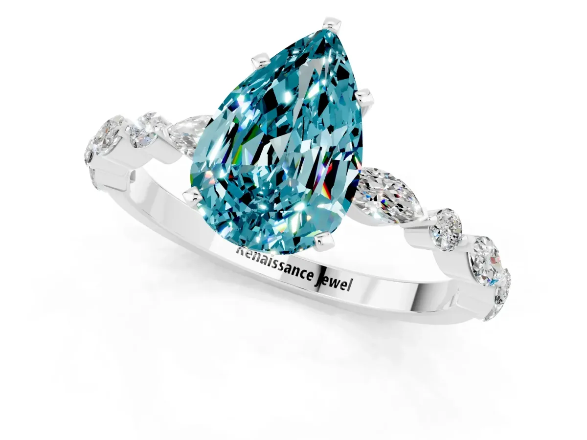 Pear Cut Blue Topaz Ring with Marquise and Round Side Stones and Four-Prong Setting Platinum