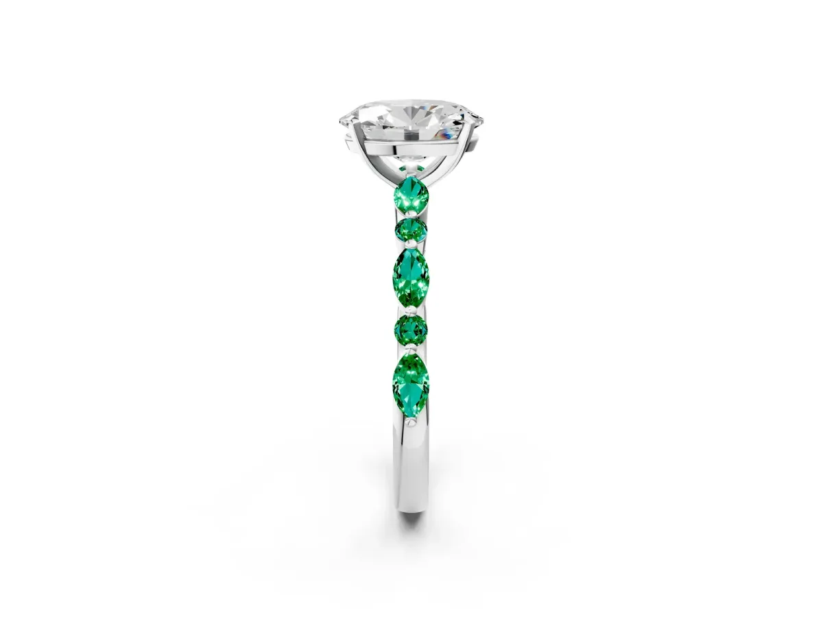 Oval Cut Diamond Ring with Marquise and Round Emerald Side Stones and Four-Prong Setting White gold