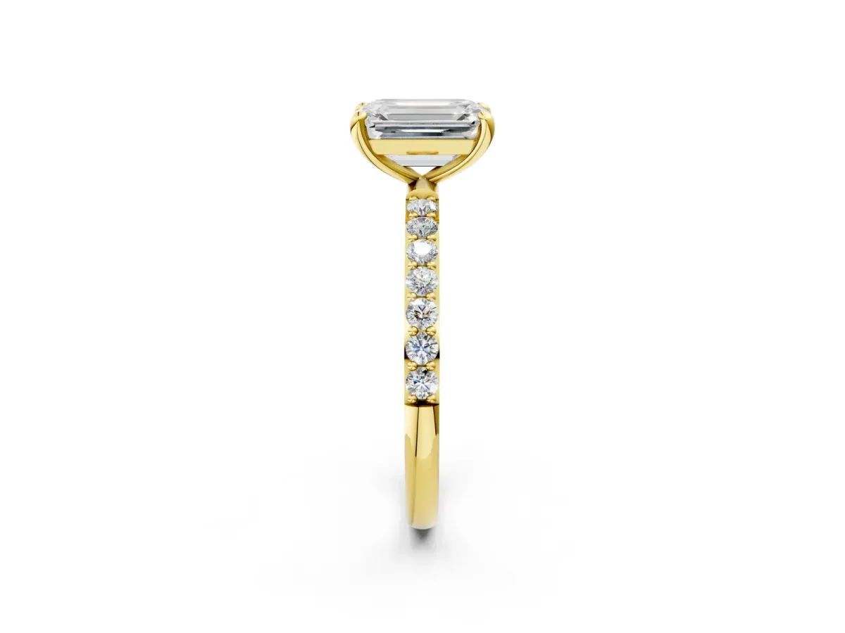 Emerald Cut Diamond Solitaire Ring with Round Pavé Band and Prong Setting Yellow gold