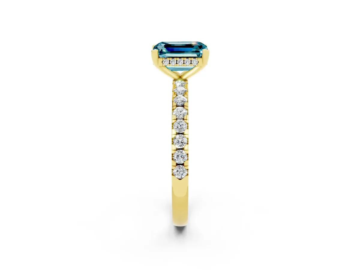 Emerald Cut Blue Topaz Solitaire Ring with Round Pavé Band and Four-Prong Setting Yellow gold