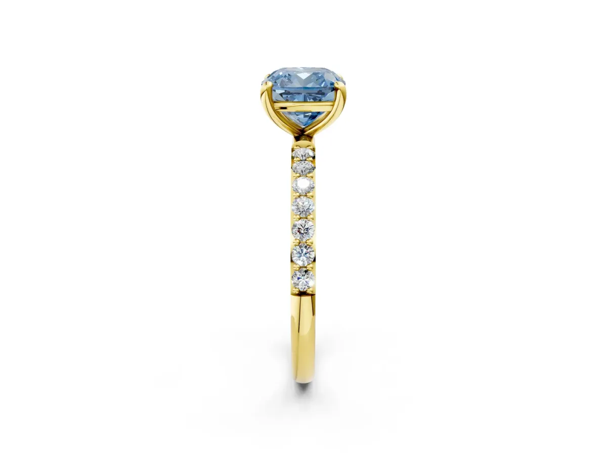 Fancy Blue Cushion Cut Diamond Solitaire Ring with Round Pavé Band and Prong Setting Yellow gold