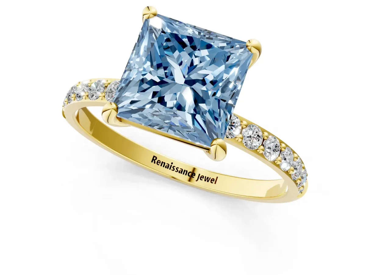 Fancy Blue Princess Cut Diamond Solitaire Ring with Round Pavé Band and Prong Setting Yellow gold