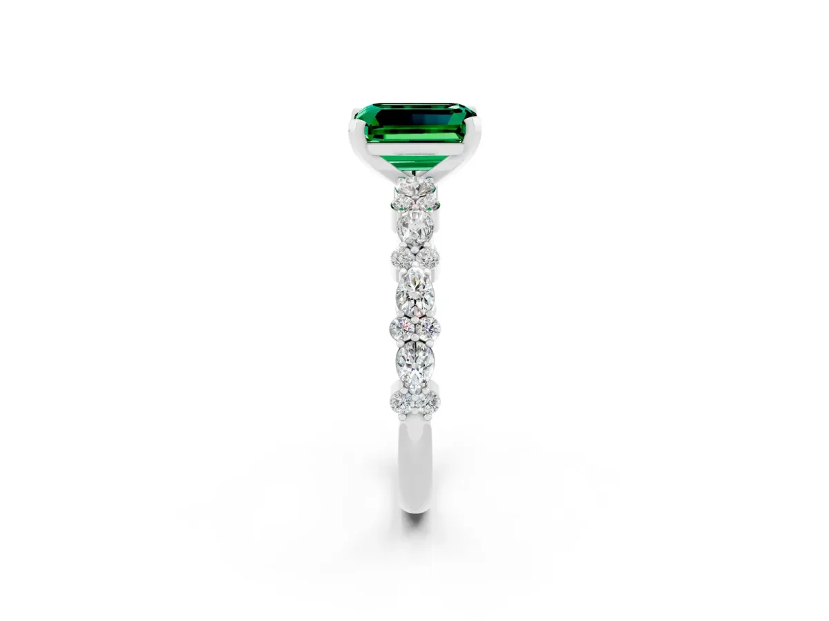 Emerald Cut Emerald Side Stone Solitaire Ring with Round and Four-Prong Setting Silver