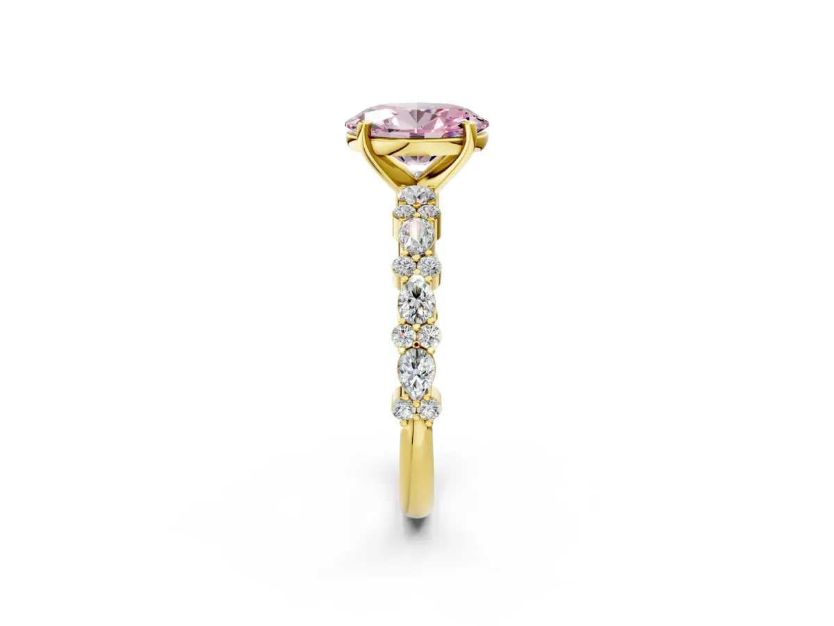 Fancy Pink Oval Cut Diamond Side Stone Solitaire Ring with Round and Four-Prong Setting Yellow gold