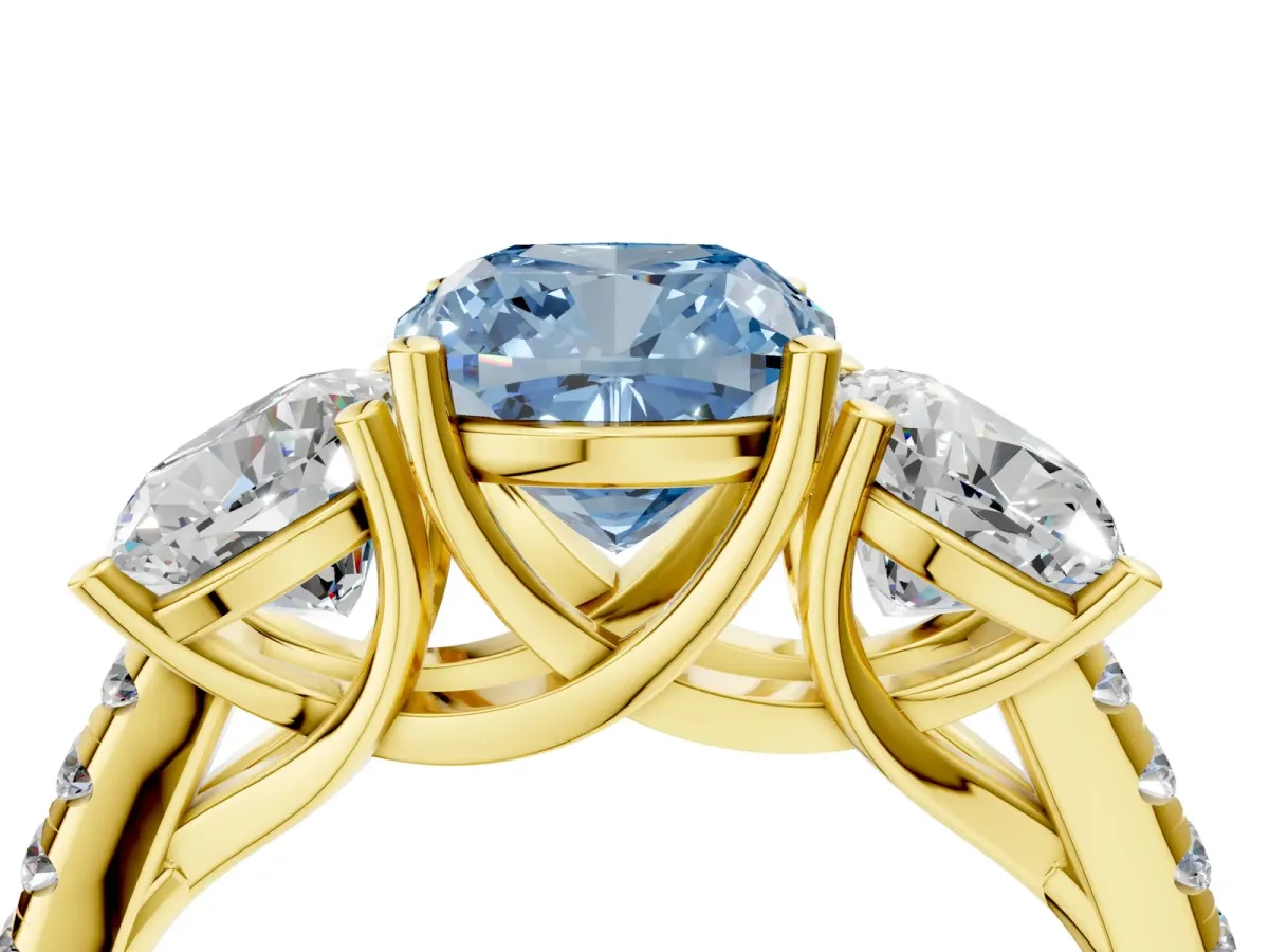 Fancy Blue Three-Stone Cushion Cut Diamond Ring with Round Pavé Band and Prong Setting Yellow gold
